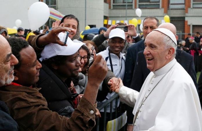 Pope Francis greets the faithful before celebrating Mass at the Church of St. Gelasius in Rome Feb. 25.